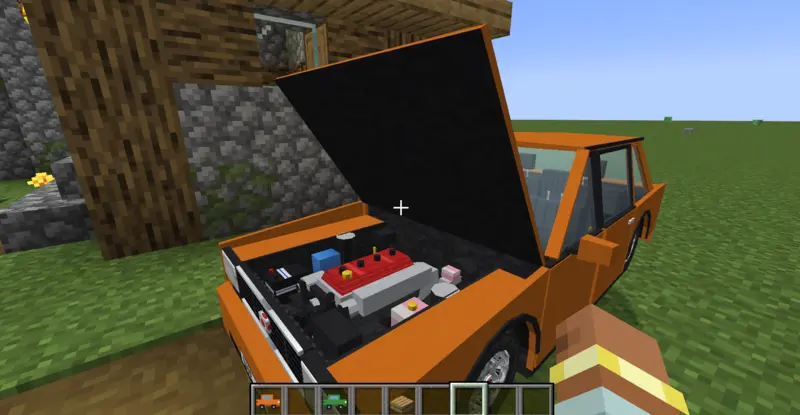 An orange car with its hood open revealing a detailed engine bay